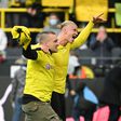 Haaland celebrates with fan after sending Dortmund top
