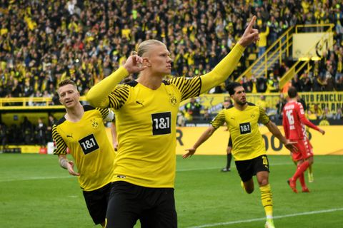 Haaland scores twice on comeback as Dortmund go top