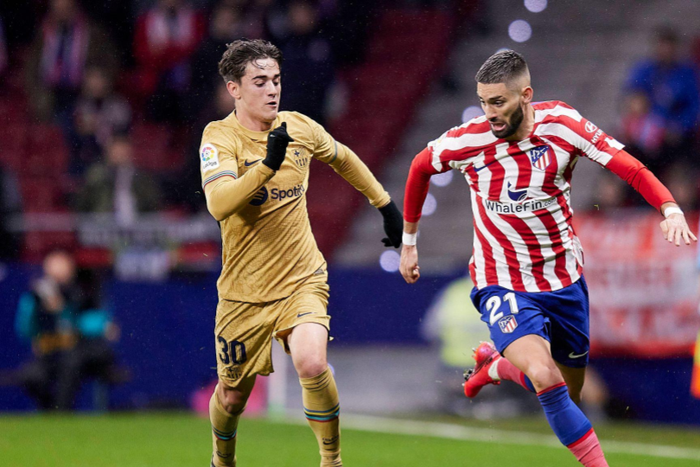 Carrasco of Atletico de Madrid and Pablo Martin Gavira Gavi of FC Barcelona, Barca during La Liga football match between Atletico de Madrid and FC Barcelona