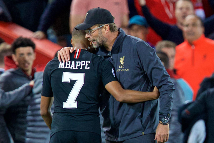 Liverpool s manager Jurgen Klopp (R) embraces Paris Saint-Germain s Kylian Mbappe after the UEFA Champions League Group C match between Liverpool and Paris Saint-Germain at Anfield Stadium in Liverpool, Britain on Sept. 18, 2018. || Image credit: Imago