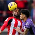 Frank Onyeka contests the ball with Liverpool's Luis Diaz during the match.