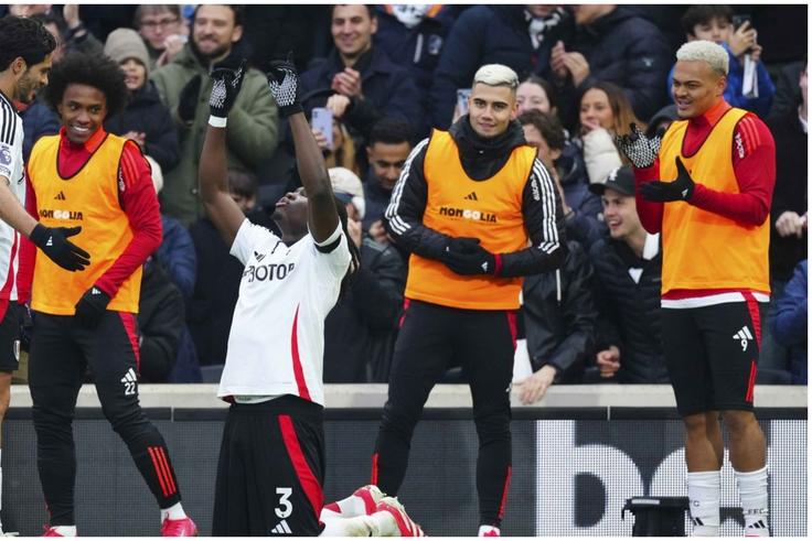 Calvin Bassey with his Fulham teammates at the Craven Cottage.