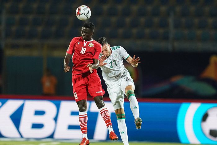 Kenya’s Eric Johana challenges Selmane Bensebaini of Algeria during the 2019 Afcon finals.