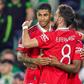 Manchester United's Marcus Rashford celebrates a goal with Bruno Fernandes during the Europa League match against Real Betis.