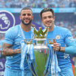 Kyle Walker and Jack Grealish lifting the Premier League trophy