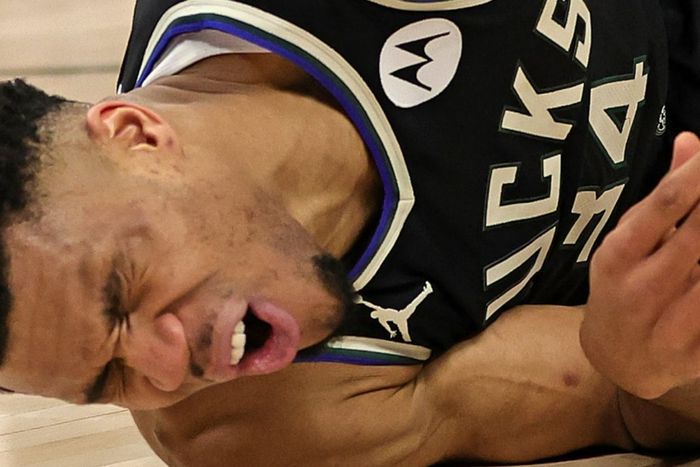 Giannis Antetokounmpo abruptly landed on his back following contact with Kevin Love on a drive to the basket.