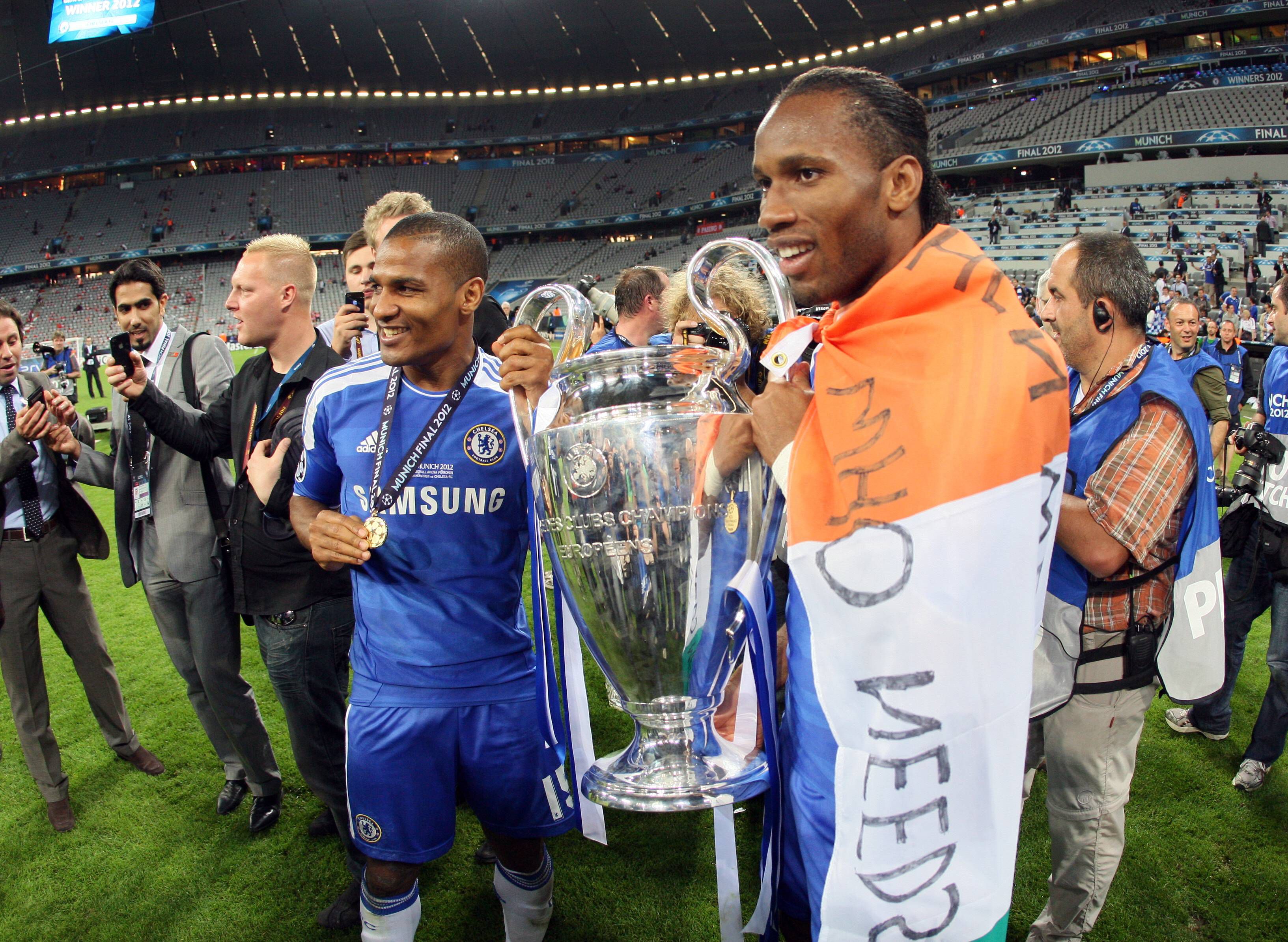 Florent Malouda (L) celebrating Chelsea's 2012 Champions League win with Didier Drogba (R)