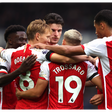 Arsenal players celebrating Trossard's goal
