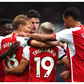 Arsenal players celebrating Trossard's goal
