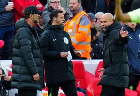 Find out why coins were thrown at Pep Guardiola at Anfield