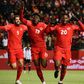 Alphonso Davies celebrating with his teammates after scoring for Canada