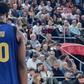Nigerian D'Tigers star Chimezie Metu injures his knee playing for Barcelona against Valencia.
