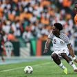 Nigeria international Ola Aina fends off pressure from an Ivory Coast opponent