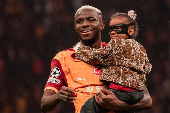 Nigeria's Victor Osimhen and his daughter after the game vs Juventus.