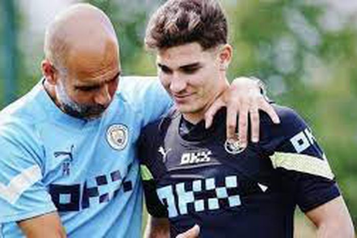 Manchester City manager Pep Guardiola with Julian Alvarez
