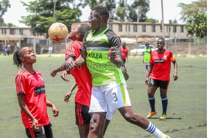 Kayole Starlets in action against Falling Waters Barcelona FC at the Camp Toyoyo Grounds.