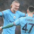 Manchester City's Erling Haaland and Phil Foden celebrate a goal