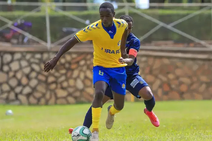 Shafiq Kagimu vies for the ball with Solito Bright Stars captain Nelson Senkatuka during a past league match (Photo credit: URA FC)