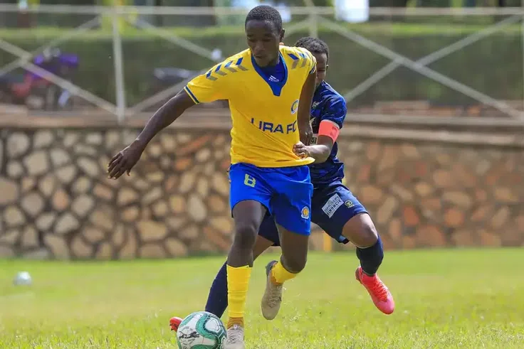 Shafiq Kagimu vies for the ball with Solito Bright Stars captain Nelson Senkatuka during a past league match (Photo credit: URA FC)