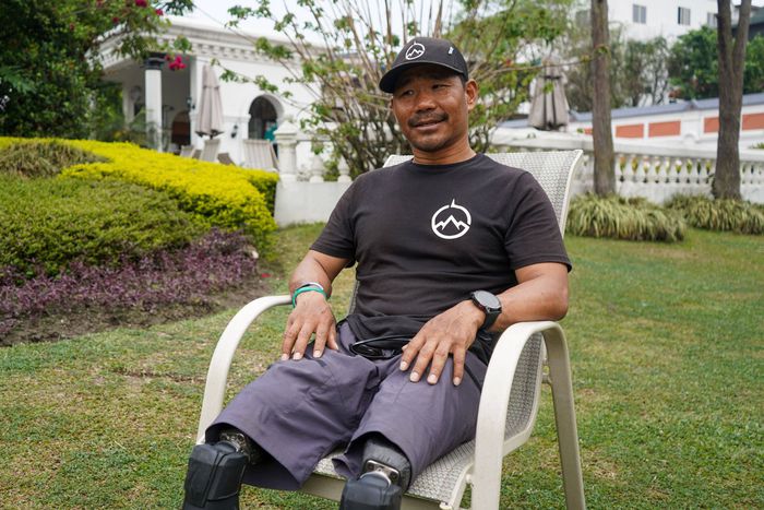 Double-amputee Hari Budha Magar, 43, poses to the media after an interview in Kathmandu, Nepal.