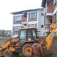 An earthmover demolishing a house in Kitale.