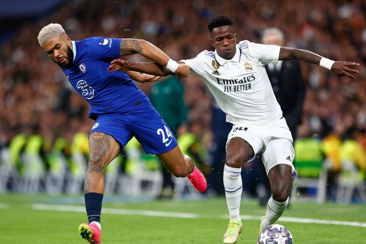 Reece James of Chelsea FC and Vinicius Junior of Real Madrid CF during the UEFA Champions League match between Real Madrid and Chelsea FC played at Santiago Bernabeu Stadium.