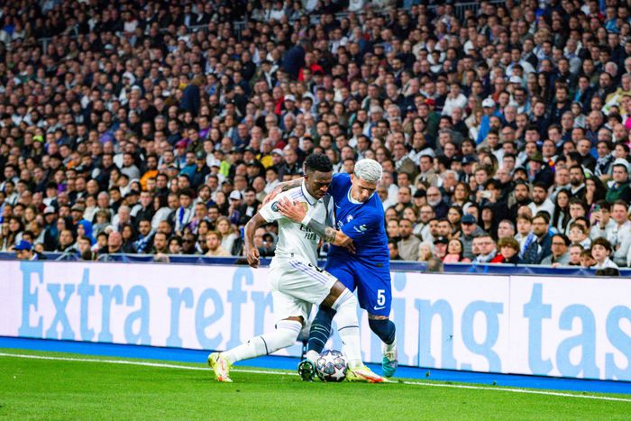 Real Madrid's Vinicius Junior and Enzo Fernandez of Chelsea
