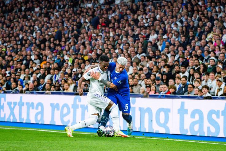 Real Madrid's Vinicius Junior and Enzo Fernandez of Chelsea