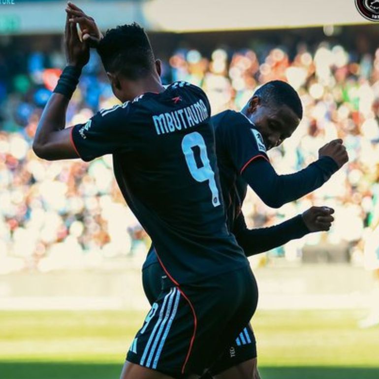 Mbuthuma celebrates with a teammate