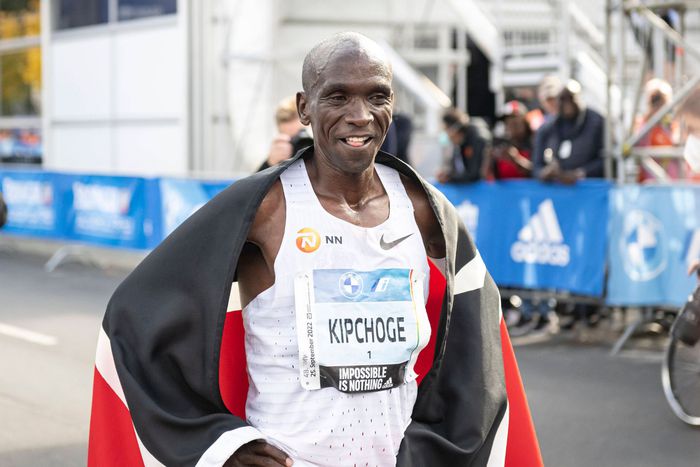 Eliud Kipchoge poses for a photo after winning the 2022 Berlin Marathon