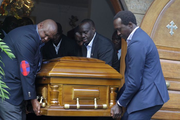 NOCK treasurer Anthony Kariuki and athletes' representative Humphrey Kayange, among other pallbearers, lift the casket of second deputy president Waithaka Kioni at Lee Funeral Home.