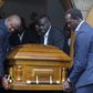 NOCK treasurer Anthony Kariuki and athletes' representative Humphrey Kayange, among other pallbearers, lift the casket of second deputy president Waithaka Kioni at Lee Funeral Home.