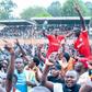 Shabana FC fans carry players aloft after securing top flight promotion.