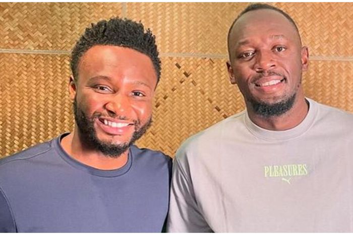 Mikel Obi and Usain Bolt after the chat.