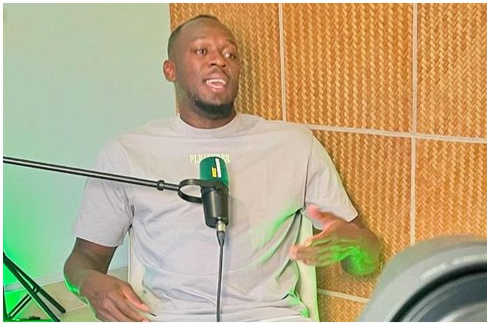 Jamaican track legend Usain Bolt speaking during a chat with Mikel Obi.