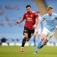 Manchester United s Bruno Fernandes (left) and Manchester City s Kevin De Bruyne battle for the ball during the Premier League match at the Etihad Stadium || Image credit: Imago