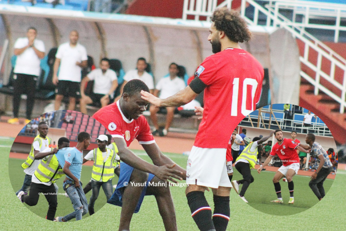 Mo Salah gets mobbed on the pitch during World Cup qualifier in Sierra Leone