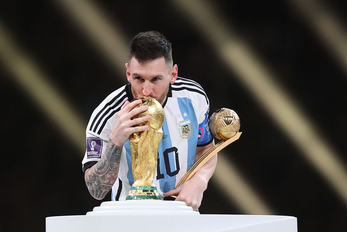 Lionel Messi with the World Cup trophy after leading Argentina to victory against France in the final in Qatar