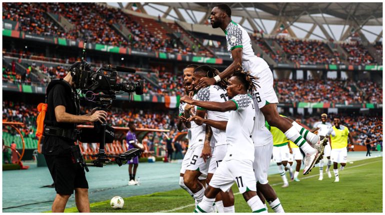 Super Eagles players celebrate against Cote d'Ivoire at AFCON