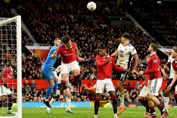 Harry Maguire of Manchester United heads the ball during their FA Cup match against Fulham at Old Trafford.