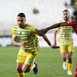 CAF Champions League El Hocine Mouaki Dadi of JS Kabylie (L) and Amine Farhane of WA Casablanca (R) battle for the ball during the 2022/23 CAF Champions League football match between JS Kabylie and WA Casablanca at Stade du July 5, 1962 in Algiers