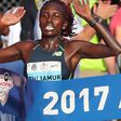 Aliphine Tuliamuk hits the finish line to win the women s division in the 48th running of the AJC Peachtree Road Race in 2017.