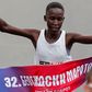 Judith Jeptum Korir celebrates as she passes the finish line at the 32nd Belgrade marathon.