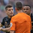 Granit Xhaka and Thomas Partey of Arsenal argue with referee.