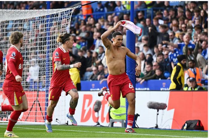 Trent celebrates the winner for Liverpool.