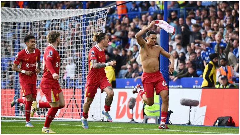 Trent celebrates the winner for Liverpool.