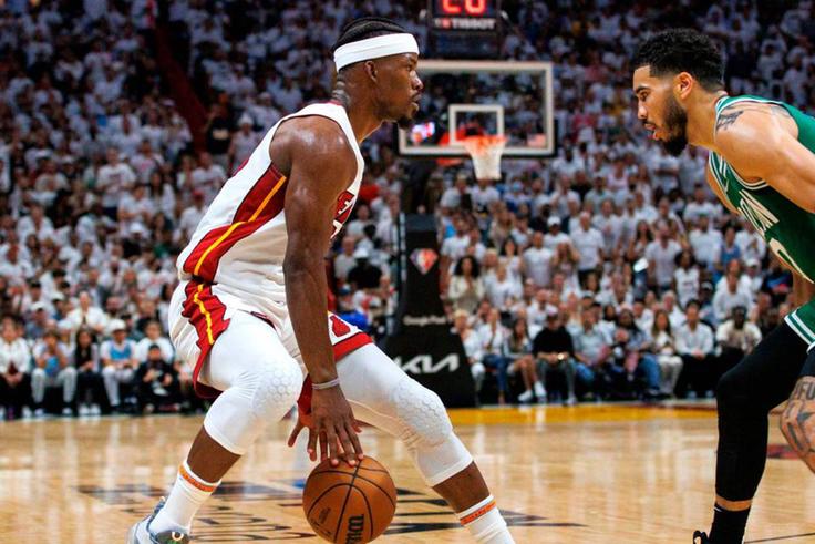 Miami Heat forward Jimmy Butler (left) drives against Boston Celtics forward Jayson Tatum during the NBA Eastern Conference Finals in Miami.