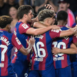 Barcelona players celebrate scoring against Cadiz || Imago