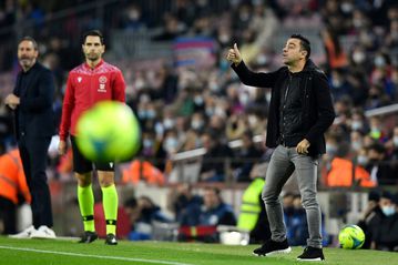 Barca edge past Espanyol to give Xavi debut victory as coach