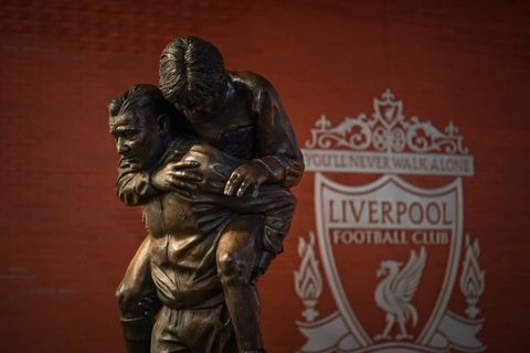 Statue of Paisley carrying future Liverpool captain Emlyn Hughes at Anfield